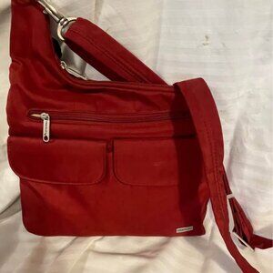 Red Travelon theft resistant women’s crossbody soulder bag purse